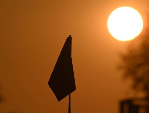 Flag is seen at sunrise during the Pro-Am prior to the start of the The Amundi Evian Championship at Evian Resort Golf Club on July 21, 2021 in...