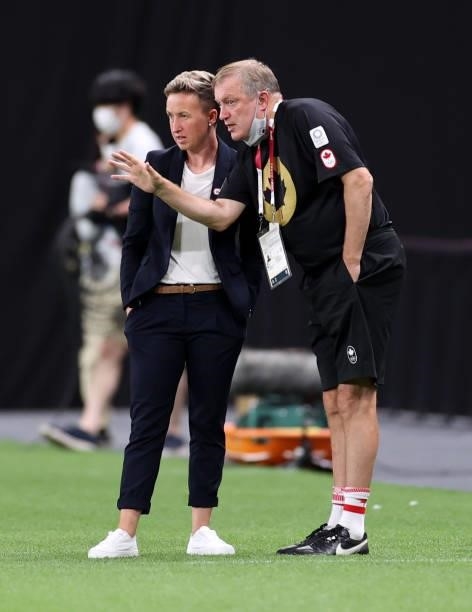 Bev Priestman, Head Coach of Team Canada speaks with Mike Norris, Assistant Head Coach of Team Canada during the Women's First Round Group E match...