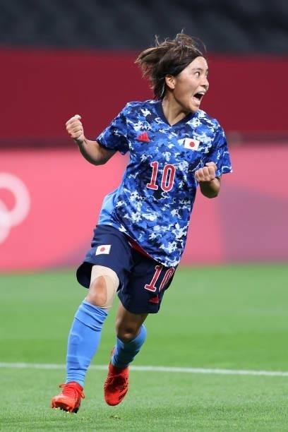 Mana Iwabuchi of Team Japan celebrates after scoring their side's first goal during the Women's First Round Group E match between Japan and Canada...