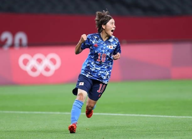 Mana Iwabuchi of Team Japan celebrates after scoring their side's first goal during the Women's First Round Group E match between Japan and Canada...
