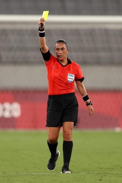 Match Referee, Lucila Venegas shows CJ Bott of Team New Zealand a yellow card during the Women's First Round Group G match between Australia and New...
