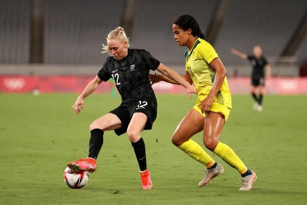 Betsy Hassett of Team New Zealand battles for possession with Mary Fowler of Team Australia during the Women's First Round Group G match between...