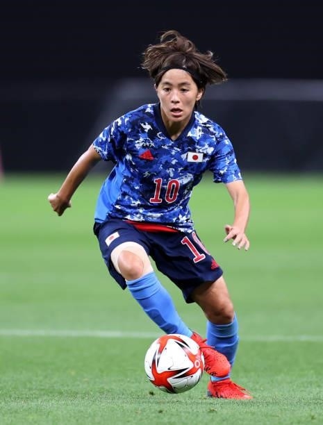 Mana Iwabuchi of Team Japan runs with the ball during the Women's First Round Group E match between Japan and Canada during the Tokyo 2020 Olympic...