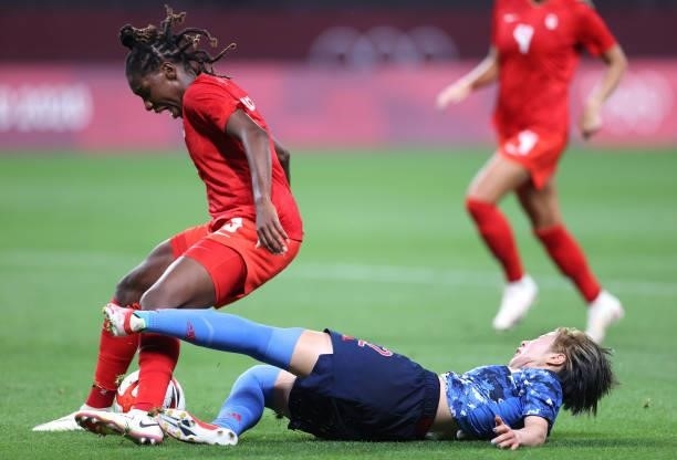 Kadeisha Buchanan of Team Canada is challenged by Jun Endo of Team Japan during the Women's First Round Group E match between Japan and Canada during...