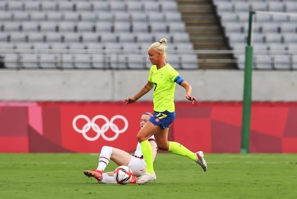 Rose Laveller of United States vies with Caroline Seger of Sweden in the Women's First Round Group G match between Sweden and United States during...