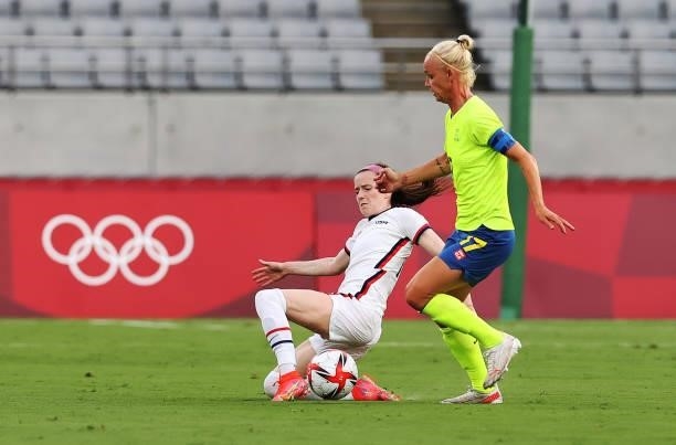 Rose Laveller of United States vies with Caroline Seger of Sweden in the Women's First Round Group G match between Sweden and United States during...