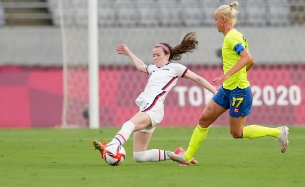 Rose Lavelle of the United States reaching for a ball during a game between Sweden and USWNT at Tokyo Stadium on July 21, 2021 in Tokyo, Japan.