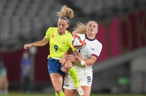Kosovare Asllani of Sweden and Lindsey Horan of USA battle for a ball during a game between Sweden and USWNT at Tokyo Stadium on July 21, 2021 in...