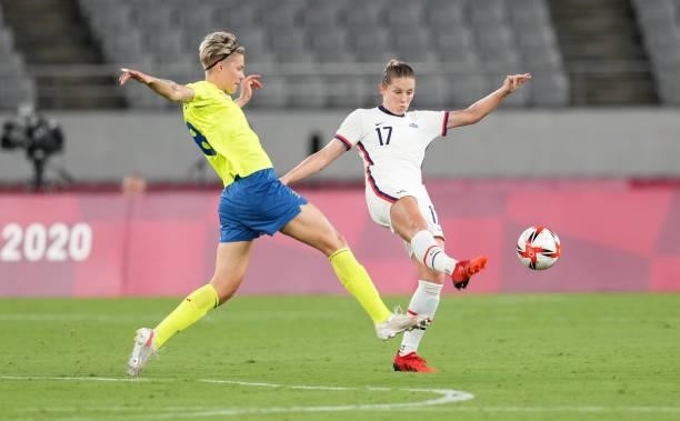 Abby Dahlkemper of the United States clears a ball during a game between Sweden and USWNT at Tokyo Stadium on July 21, 2021 in Tokyo, Japan.