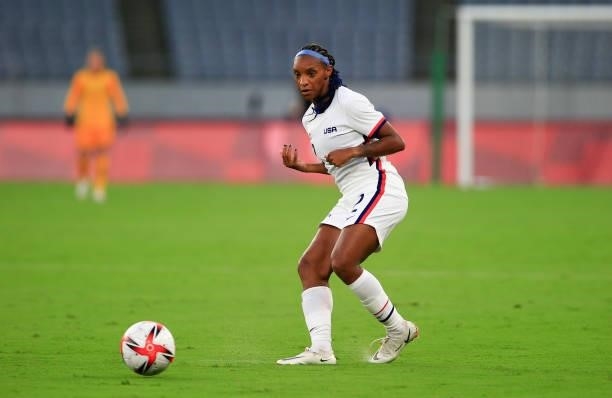 Crystal Dunn of the United States passes off the ball during a game between Sweden and USWNT at Tokyo Stadium on July 21, 2021 in Tokyo, Japan.
