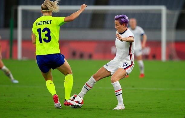 Amanda Ilestedt of Sweden and Megan Rapinoe of USA meet during a game between Sweden and USWNT at Tokyo Stadium on July 21, 2021 in Tokyo, Japan.