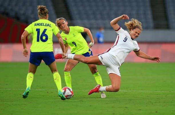 Lindsey Horan of the United States get's drilled during a game between Sweden and USWNT at Tokyo Stadium on July 21, 2021 in Tokyo, Japan.
