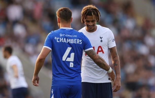 Dele Alli of Tottenham Hotspur interacts with Luke Chambers of Colchester United during the Pre-Season Friendly match between Colchester United and...
