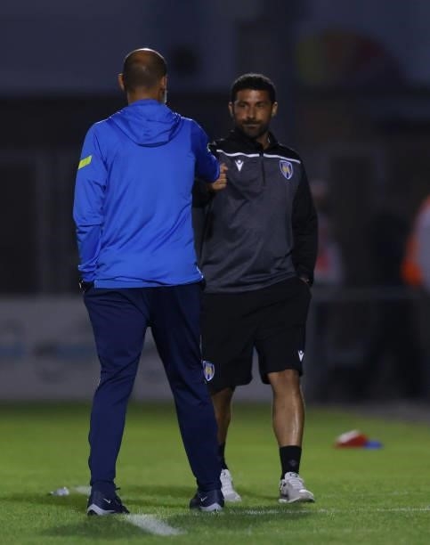 Nuno Espirito Santo, Manager of Tottenham Hotspur interacts with Hayden Mullins, Manager of Colchester United during the Pre-Season Friendly match...