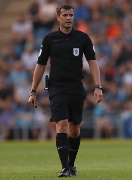 Referee Craig Hicks looks on during the Pre-Season Friendly match between Colchester United and Tottenham Hotspur at JobServe Community Stadium on...
