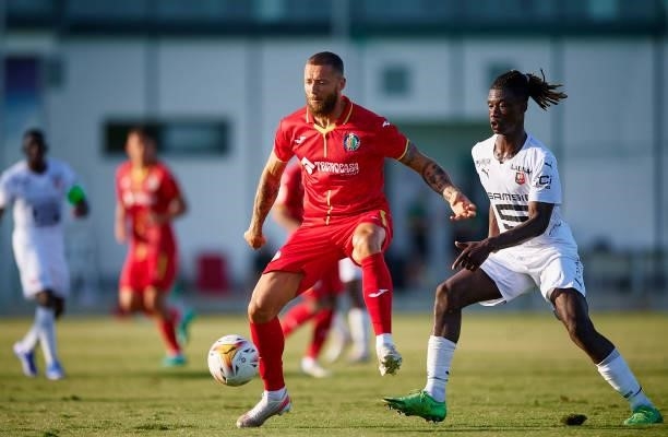 David Timor of Getafe competes for the ball with Eduardo Camavinga of Stade Rennais during a Pre-Season friendly match between Getafe and Stade...