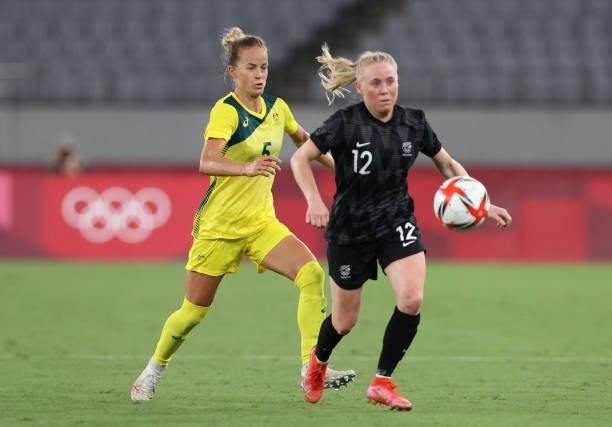Aivi Luik of Australia vies with Betsy Hassett of New Zealand in the Women's First Round Group G match between New Zealand and Australia during the...