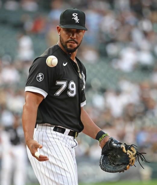 Jose Abreu of the Chicago White Sox juggles the ball during warm-ups in-between innings against the Minnesota Twins at Guaranteed Rate Field on July...