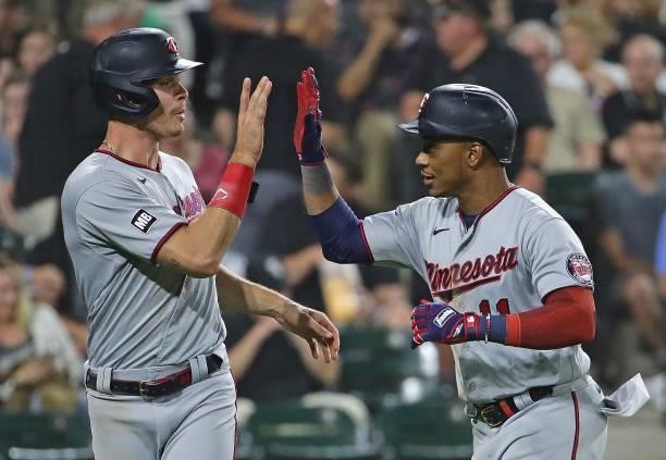 Jorge Polanco of the Minnesota Twins is greeted by Max Kepler after hitting a three run home run in the 6th inning against the Chicago White Sox at...