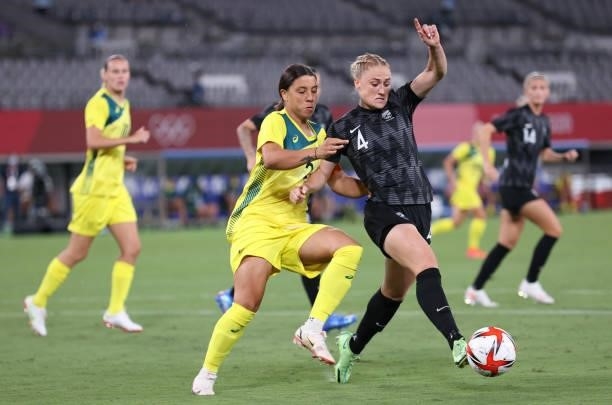 Sam Kerr of Australia vies with CJ Bott of New Zealand in the Women's First Round Group G match between New Zealand and Australia during the Tokyo...