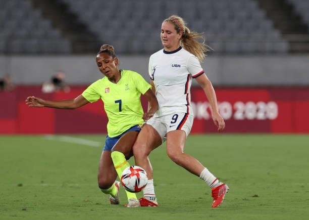 Madelen Janogy of Sweden vies with Lindsey Horan of United States is seen in the Women's First Round Group G match between Sweden and United States...