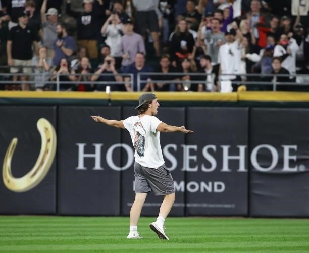 Fan runs onto the field in the 9th inning during a game between the Chicago White Sox and the Minnesota Twins at Guaranteed Rate Field on July 21,...