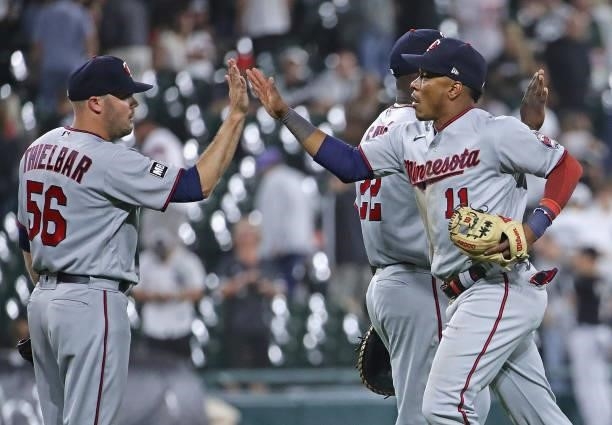 Caleb Thielbar and Jorge Polanco of the Minnesota Twins celebrate a win over the Chicago White Sox at Guaranteed Rate Field on July 21, 2021 in...