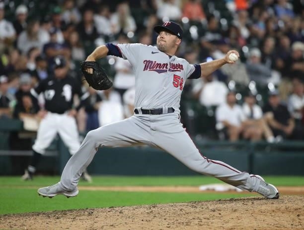 Caleb Thielbar of the Minnesota Twins pitches the 9th inning against the Chicago White Sox at Guaranteed Rate Field on July 21, 2021 in Chicago,...