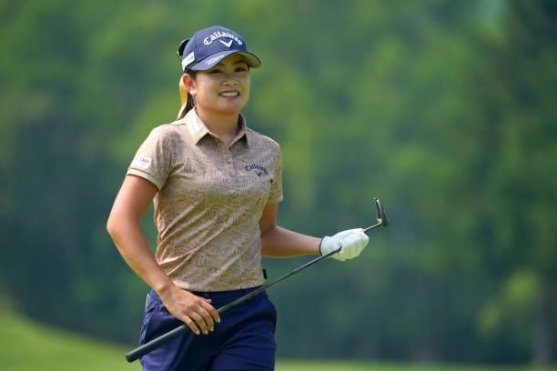 Yui Kawamoto of Japan smiles after a putt on the 7th green during the first round of Daito Kentaku eHeyanet Ladies at Takino Country Club on July 22,...