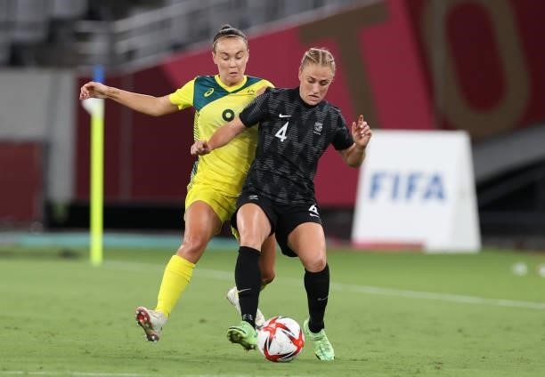 Caitlin Foord of Australia vies with CJ Bott of New Zealand in the Women's First Round Group G match during the Tokyo 2020 Olympic Games at Tokyo...
