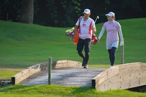 Saiki Fujita of Japan crosses the bridge with her caddie on the 9th hole on the 9th hole during the first round of Daito Kentaku eHeyanet Ladies at...