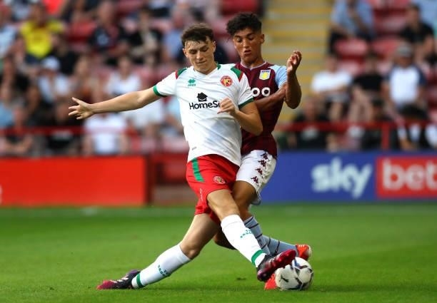 Joe Willis of Walsall and Ben Chrisene of Aston Villa battle for the ball during the Pre Season Friendly between Walsall and Aston Villa at Banks's...
