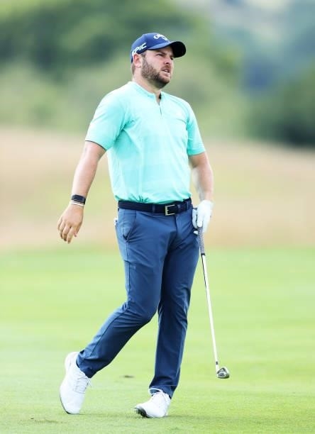 Jordan Smith of England reacts after playing his second shot on hole 1 during Day One of the Cazoo Open supported by Gareth Bale at Celtic Manor...