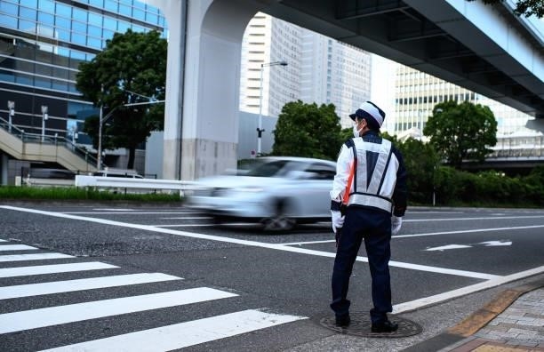 Traffic police officer stands outside Main Press center ahead of the Tokyo 2020 Olympic Games on July 22, 2021 in Tokyo, Japan.