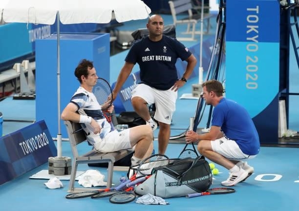 Andy Murray of Great Britain, physio of Tennis Team GB Shane Annun, captain of Tennis Team GB Leon Smith during practice ahead of the Tokyo 2020...