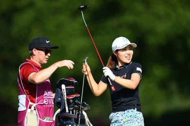 Ayaka Furue of Japan talks with her caddie on hole 18 during day one of the The Amundi Evian Championship at Evian Resort Golf Club on July 22, 2021...