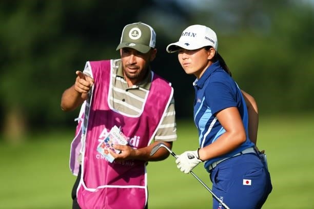 Tsubasa Kajitani of Japan tlaks with her caddie on hole 18 during day one of the The Amundi Evian Championship at Evian Resort Golf Club on July 22,...
