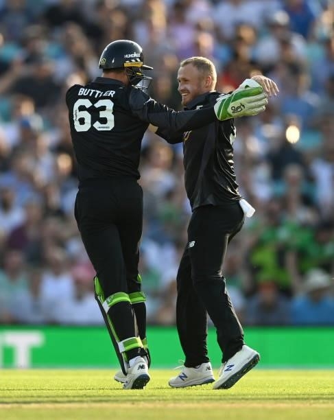 Matt Parkinson of Manchester Originals celebrates with Jos Buttler after dismissing Will Jacks of Oval Invincibles during the Hundred match between...