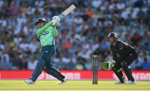 Jason Roy of Oval Invincibles bats watched by Manchester Originals wicketkeeper Jos Buttler during the Hundred match between Oval Invincibles and...