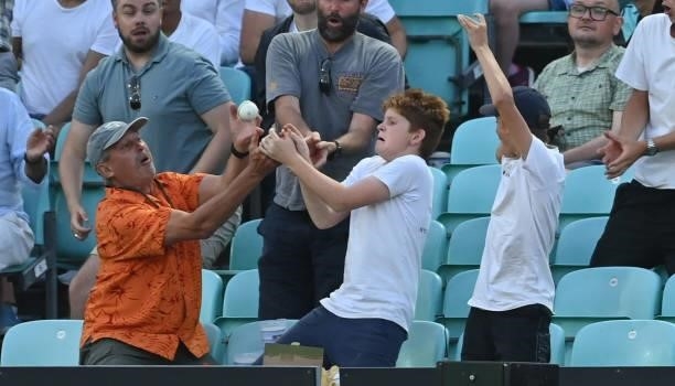 Spectators fail to catch a six during the Hundred match between Oval Invincibles and Manchester Originals at The Kia Oval on July 22, 2021 in London,...