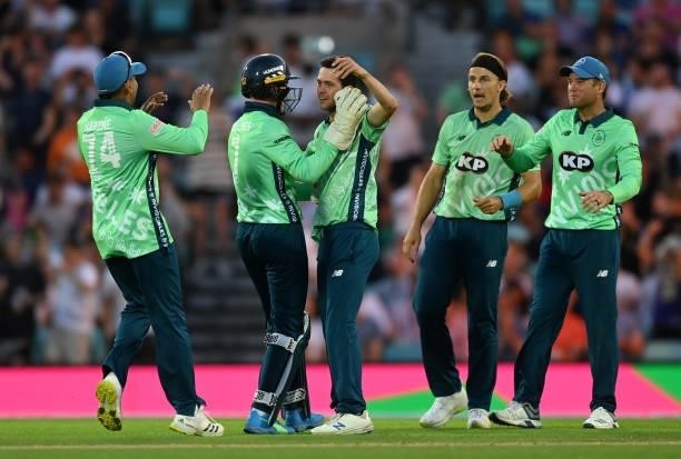 Nathan Sowter of Oval Invincibles celebrates with teammates after dismissing Colin Munro of Manchester Originals during the Hundred match between...