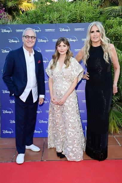 Daniel Frigo, Elizabeth Olsen and Tiziana Rocca attend the Filming Italy Festival at Forte Village Resort on July 22, 2021 in Santa Margherita di...