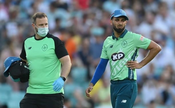 Saqib Mahmood of Oval Invincibles appears injured during the Hundred match between Oval Invincibles and Manchester Originals at The Kia Oval on July...
