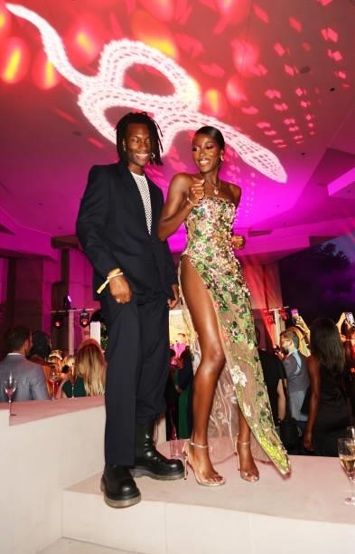 Guest and AJ Odudu attend the Bulgari Serpenti Metamorphosis party at The Serpentine Gallery on July 22, 2021 in London, England.