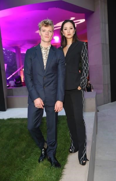 Tom Rhys Harries and Betty Bachz attend the Bulgari Serpenti Metamorphosis party at The Serpentine Gallery on July 22, 2021 in London, England.