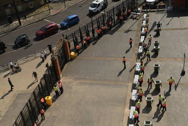 Stewards prepare to open the gates before the Hundred match between Oval Invincibles and Manchester Originals at The Kia Oval on July 22, 2021 in...