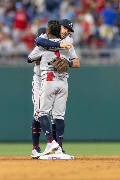 Dansby Swanson of the Atlanta Braves hugs Ozzie Albies against the Philadelphia Phillies at Citizens Bank Park on July 22, 2021 in Philadelphia,...