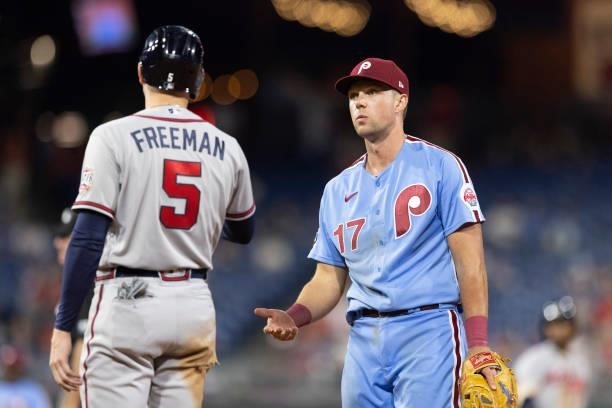 Freddie Freeman of the Atlanta Braves talks to Rhys Hoskins of the Philadelphia Phillies at Citizens Bank Park on July 22, 2021 in Philadelphia,...