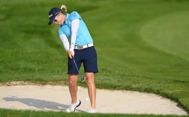 Alena Sharp of Canada plays a shot from a bunker on the 11th hole during day two of the The Amundi Evian Championship at Evian Resort Golf Club on...