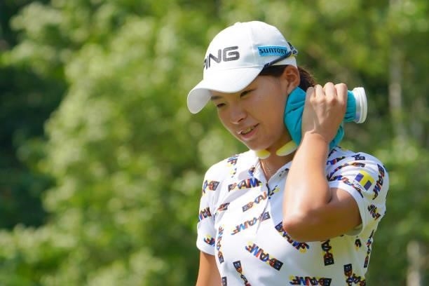 Hinako Shibuno of Japan holds an ice bag on her neck to cool herself down on the 5th hole during the second round of Daito Kentaku eHeyanet Ladies at...